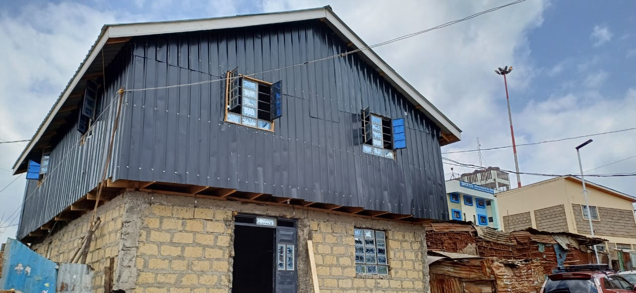 Church building with roof and cladding going up