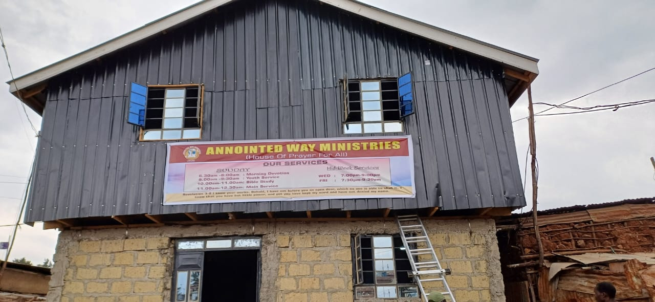 Church building with the Annointed Way Ministries banner